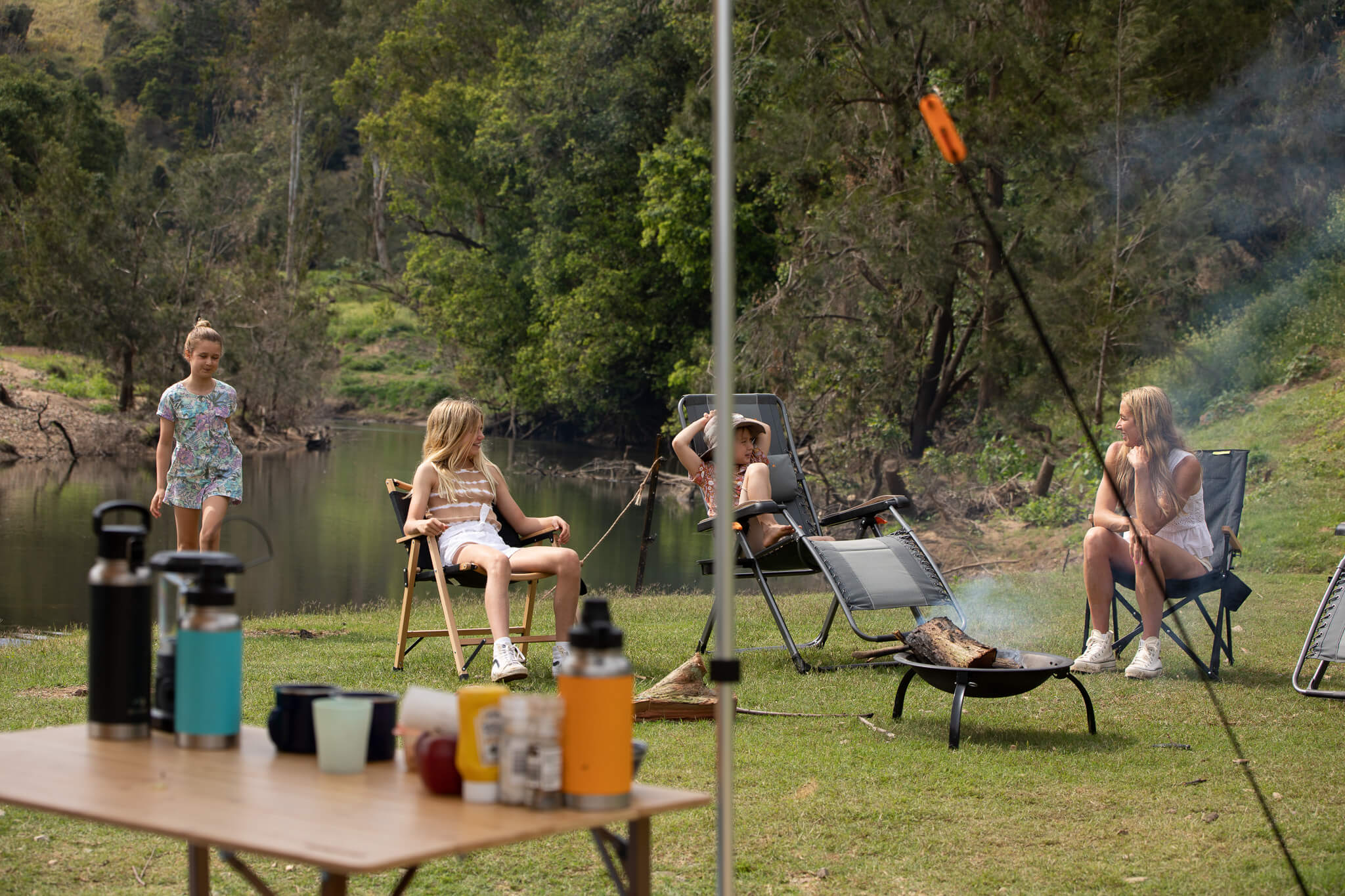 Family sitting down at camp